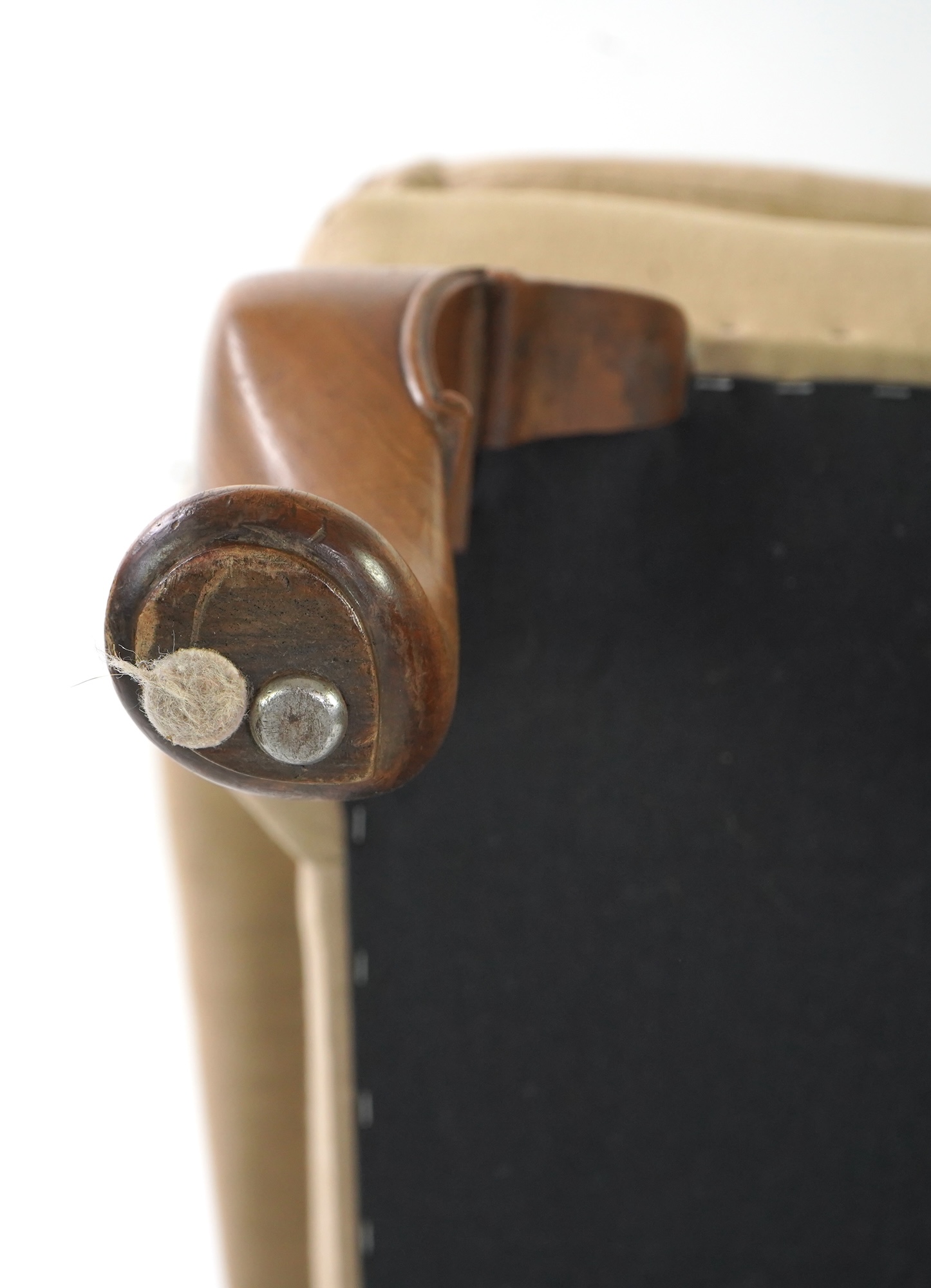 A pair of late 19th / early 20th century George II style upholstered wing armchairs